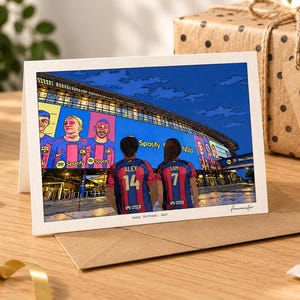 May include: A greeting card featuring a cartoon illustration of two people wearing blue and red soccer jerseys with the names ALEX 14 and SAM 7, standing before a stadium with a large Spotify banner. The text Happy Birthday, Dad! is printed below.