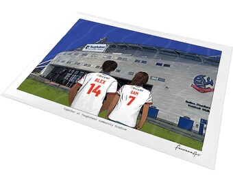 May include: A digital illustration of two individuals wearing white soccer jerseys with the names ALEX 14 and SAM 7 printed on the back, standing before the Toughsheet Community Stadium. The text Together at Toughsheet Community Stadium is visible.
