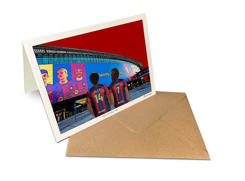May include: A folded greeting card featuring a colorful illustration of the Spotify Camp Nou stadium with players wearing red and blue jerseys. The back of the card is white, and it is accompanied by a plain brown paper envelope for mailing.