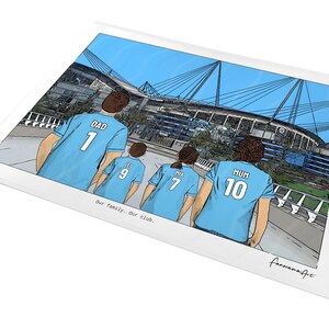 May include: A rectangular art print featuring a cartoon illustration of four people wearing light blue soccer jerseys with the names DAD, LEO, MIA, and MUM and numbers 1, 9, 7, and 10. The text Our family. Our club. is printed below the figures.