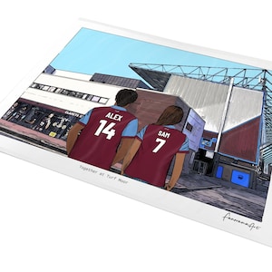 May include: A digital illustration print showing two people from behind wearing maroon and blue football shirts with the names ALEX 14 and SAM 7, standing before a stadium. The text Together at Turf Moor is printed at the bottom.