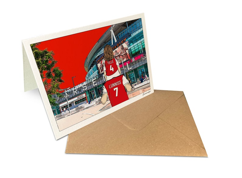 May include: A red and white illustrated greeting card featuring a cartoon of a person wearing a red and white soccer jersey with the number 7 on the back. The jersey has the name "Lunniss" on the back. The person is standing in front of a large stadium with the word "Arsenal" on the side. The background is red.