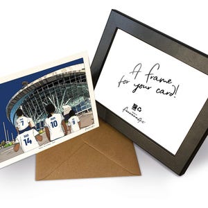 May include: A greeting card featuring an illustration of four people in white sports jerseys with numbers 7, 10, 9, and 14 standing before a stadium, a brown envelope, and a black frame with the text A frame for your card! and a logo.