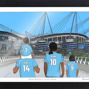 May include: A framed illustration of a family wearing light blue soccer jerseys with names and numbers on the back, standing before Etihad Stadium. The text reads 'Making memories at Etihad Stadium' at the bottom and 'fanoramaArt' in the corner.