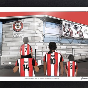 May include: A framed illustration of the Gtech Community Stadium featuring the Brentford Football Club logo. Four figures stand in front of the building wearing red and white striped jerseys with the names Max, Dad, Mum, and Ava printed on the back.
