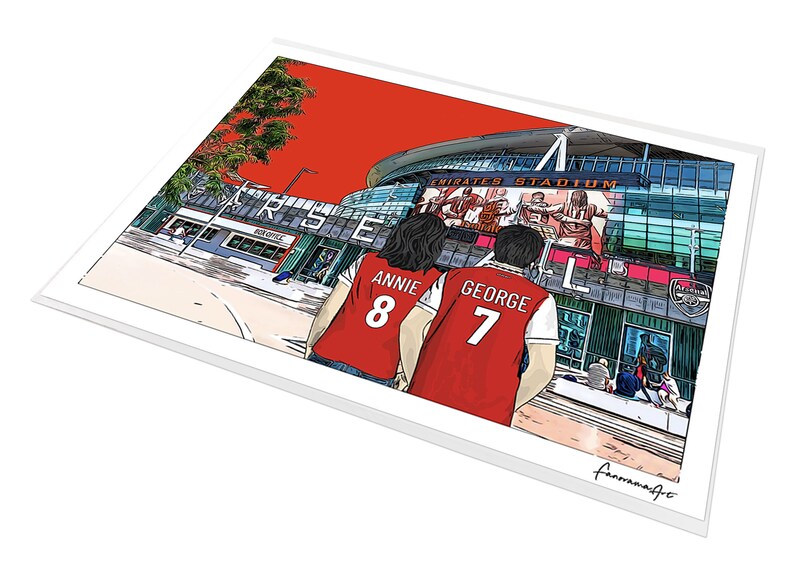 May include: A digital illustration of two people wearing red jerseys with the names "Annie 8" and "George 7" printed on the back. They are standing in front of the Emirates Stadium, home of Arsenal Football Club.