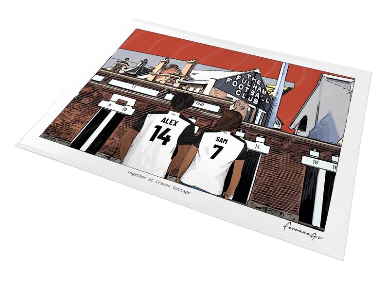 May include: A rectangular art print featuring a cartoon illustration of two people in white and black soccer jerseys with the names Alex 14 and Sam 7, standing before the Fulham Football Club stadium. The text reads Together at Craven Cottage.