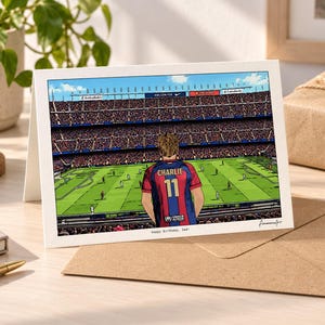 May include: A rectangular greeting card featuring a colorful illustration of a soccer player wearing a red and blue jersey with the name CHARLIE and number 11 on the back, standing in a stadium. The text Happy Birthday, Dad is printed below.