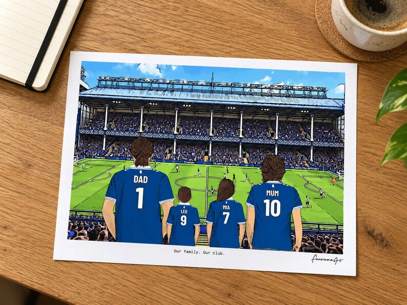 AI-created desk mockup of an unframed Everton A4 family print using the In game background.