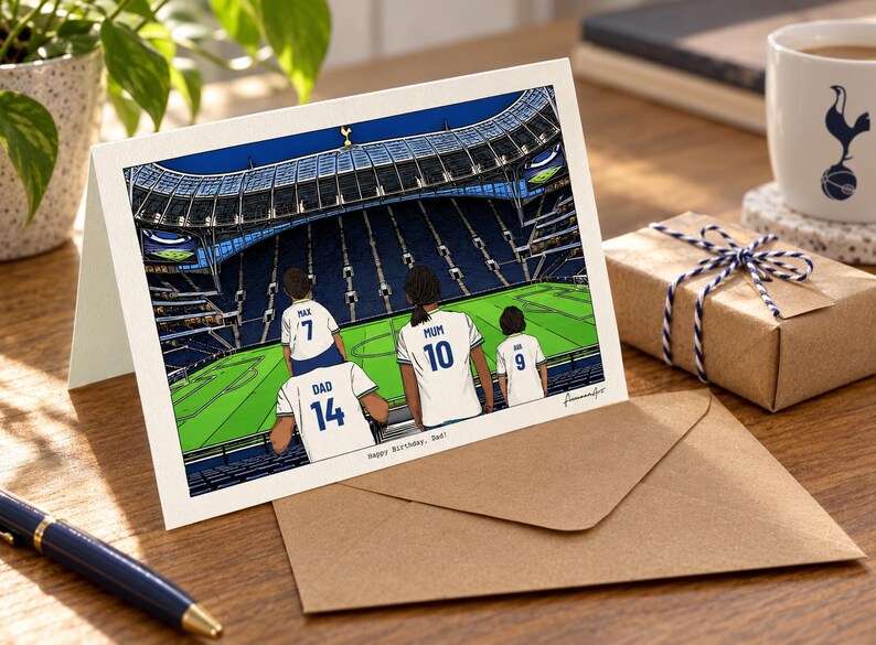 May include: A greeting card featuring an illustration of four people in white soccer jerseys with blue numbers and names sitting in a stadium. The jerseys are labeled Max 7, Dad 14, Mum 10, and Joe 9. The text at the bottom reads Happy Birthday, Dad!