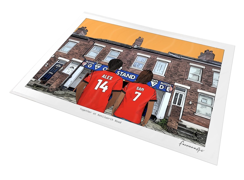 May include: A digital illustration print featuring two individuals wearing red jerseys with the names ALEX 14 and SAM 7 on the back, standing before a brick building with a blue sign labeled BLOCKS GATE F G 6 and BLOCKS GATE D E. The text Together at Kenilworth Road is printed below.