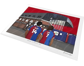 May include: A digital illustration print featuring two individuals wearing red and blue soccer jerseys with the names ALEX 14 and SAM 7 on the back, standing before a stadium exterior. The text reads Together at Selhurst Park and fanoramaArt.