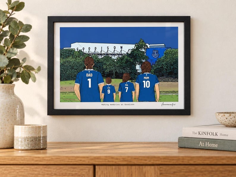 AI-created room mockup showing an example Everton A4 framed family print above an oak console. Decorative props are not included.