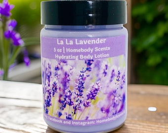 May include: A 5 ounce bottle of lavender-scented body lotion. The label reads "La La Lavender" and "Homebody Scents Hydrating Body Lotion". The bottle has a lavender-colored background with a picture of lavender flowers.