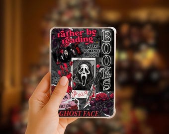 May include: A phone case featuring a collage design with the text "rather be reading" in pink. The design includes a black and white image of a Ghost Face mask, roses, and the words "Dark Romance Addict" and "Books".
