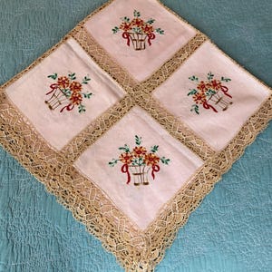 Vintage handmade tablecloth, featuring, embroidered flowers and crochet borders