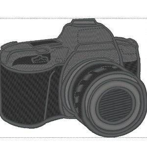 May include: A grey camera with a large lens. The camera has a textured surface and a black lens cap.