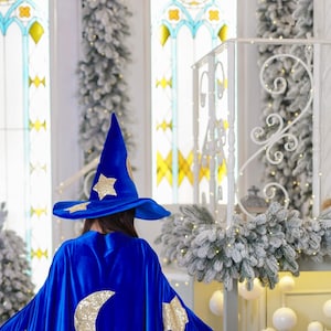 Enchanting Adult Blue Wizard Halloween Costume Set: Cape, Hat, and Magic Wand.