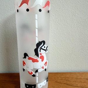 May include: A handmade, wooden cutting board with a natural finish. The board features a live edge on one side and a smooth, rectangular shape. It is approximately 18 inches long and 12 inches wide.