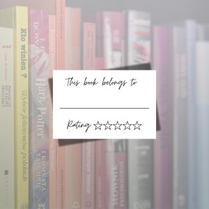 May include: A white bookplate with black text that reads "This book belongs to" with a blank line for a name and a five-star rating system below.