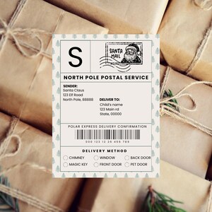 Santa-inspired North Pole delivery label sticker on a stack of brown paper-wrapped Christmas gifts. Festive design features candy cane stripes and customizable recipient details.
