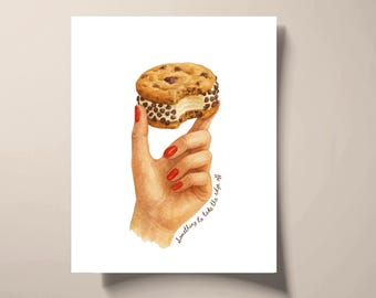 May include: Watercolor illustration of a hand with red nail polish holding a chocolate chip cookie ice cream sandwich. The cookie has a bite taken out of it. Text on the image reads "Something to take the edge off."