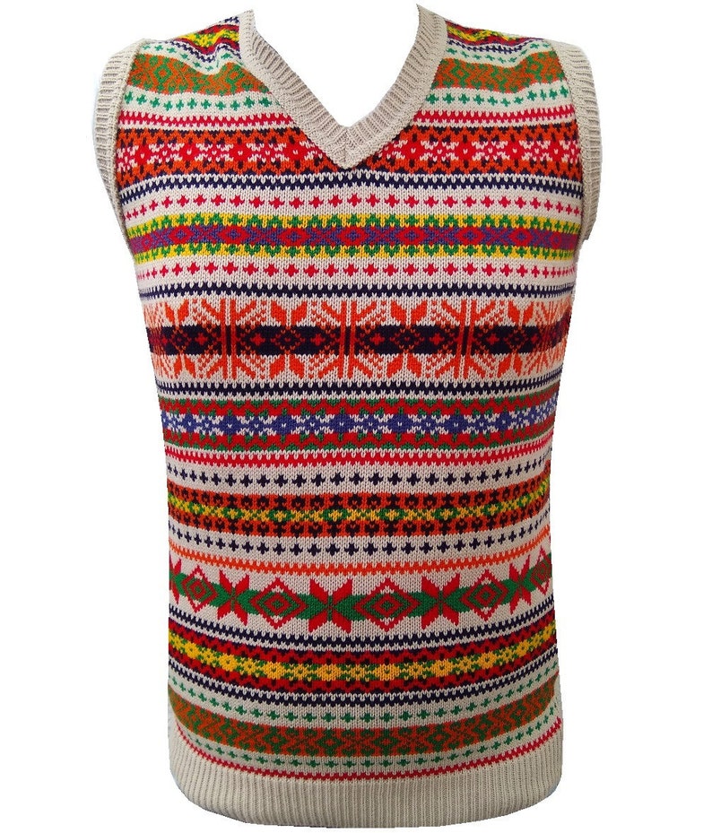 May include: A beige sleeveless sweater with a colorful geometric pattern. The pattern features stripes of red, orange, yellow, green, blue, and purple.