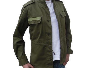 May include: A green utility jacket with a button-up front and a patch pocket on the left chest. The jacket has a light green trim around the collar and pockets.