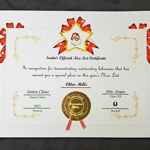 May include: A red and gold certificate with a star and Santa Claus image. The certificate reads "Santa's Official Nice List Certificate" and "In recognition for demonstrating outstanding behaviour that has earned you a special place on this year's Nice List." The certificate is signed by Santa Claus and Elfie Jingles, Chief Elf. The date is December 25th, 2023.