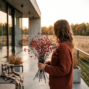 May include: A large bouquet of dried rose hip branches with numerous small, vibrant red berries on thin, dark brown stems. The branches are held together in a bundle, showcasing the natural texture and spherical shape of the red fruit.