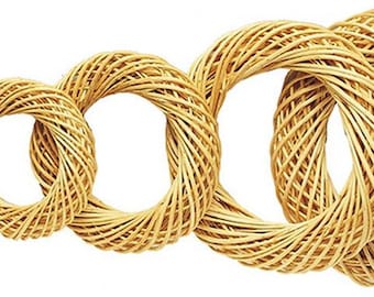 May include: A set of seven woven willow wreaths in various sizes, ranging from small to large. The wreaths are all made of natural willow branches and have a rustic, natural look.