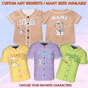 May include: Baseball jerseys in various colors, featuring cartoon characters and names. The jerseys are tan, yellow, purple, and green with striped patterns. Text on the jerseys includes "Dufty", "Cookie", "Stella Lou", and "Ole Mel". The text "CUSTOM ANY REQUESTS / MANY SIZES AVAILABLE" is at the top.