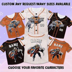 May include: Baseball jerseys in orange, black, and white with pinstripes and the text "TASKMASTER" and "NAME". Each jersey features a character graphic and the number "00". The text "CUSTOM ANY REQUEST/MANY SIZES AVAILABLE" and "CHOOSE YOUR FAVORITE CHARACTERS" are also visible.