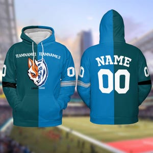 May include: A blue and teal hoodie with a split design. One side features a fox and bear logo with the text "TEAMNAME1 TEAMNAME2" and "LOGO1 LOGO2". The other side has the text "NAME 00" in white.