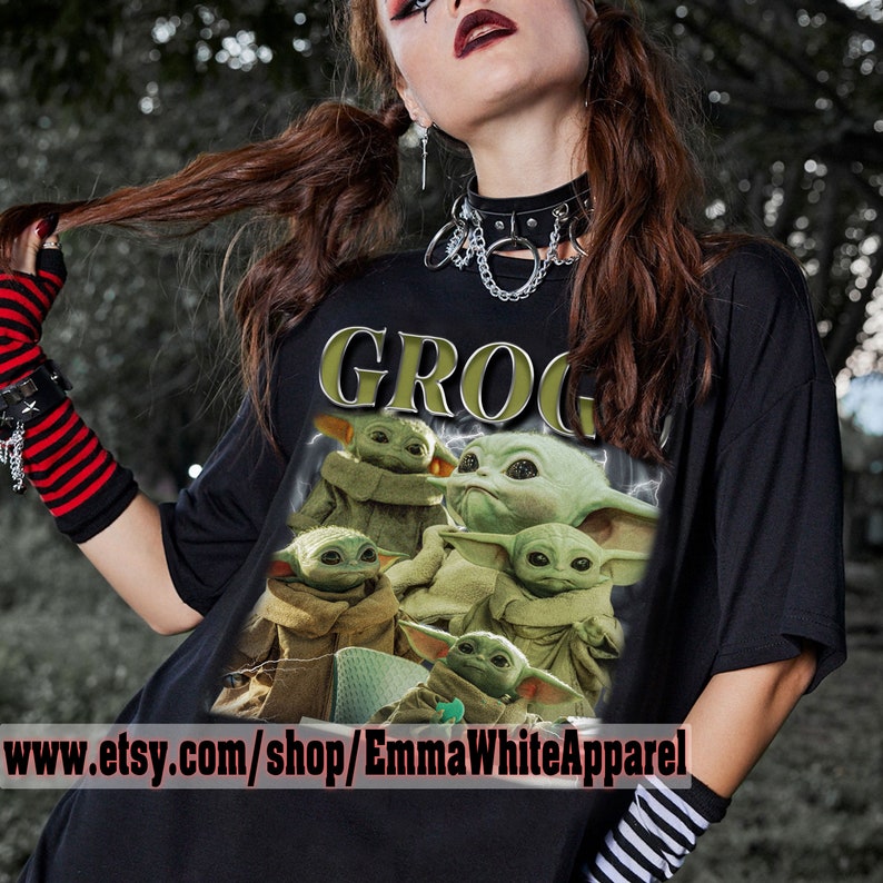 May include: Black t-shirt with a graphic print of multiple green "Baby Yoda" characters from the Star Wars series. The text "GROG" is printed in yellow above the characters.