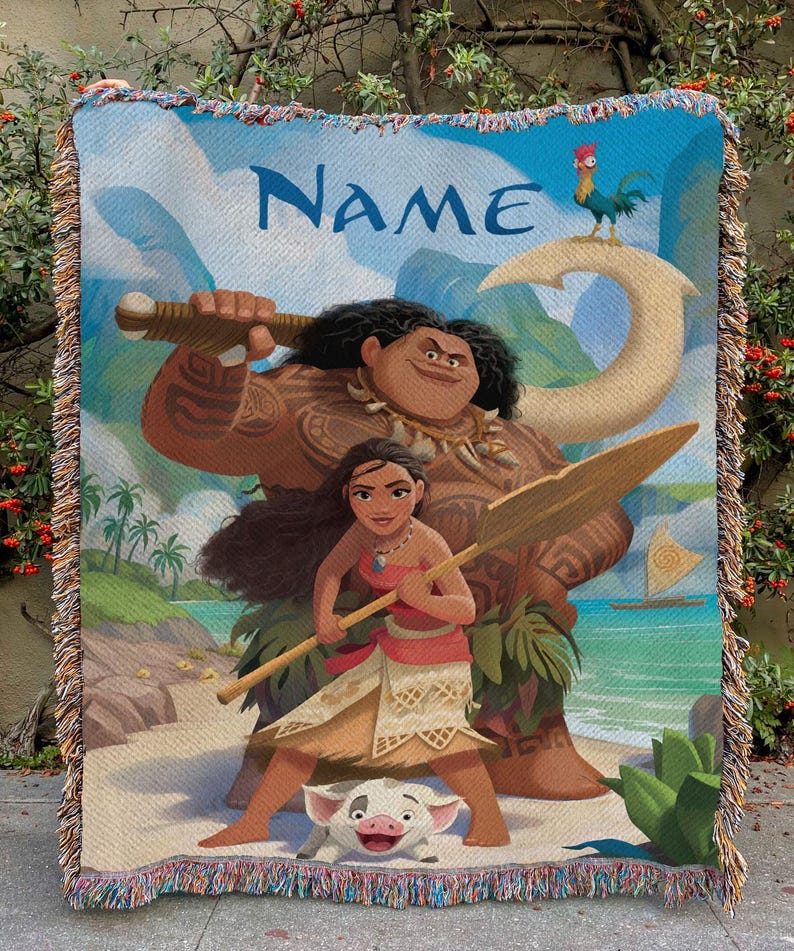 May include: A woven throw blanket with a design from a popular animated film. The image features a large figure with a weapon, a woman with a paddle, and a small pig. The word "NAME" is written across the top in blue.