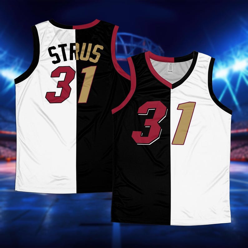 May include: A black and white basketball jersey with the name "STRUS" and the number "31" on the back. The jersey is split down the middle, with one side black and the other white.