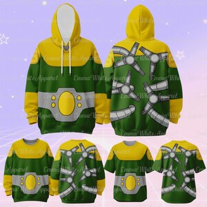 Puede incluir: Sudaderas con capucha y camisetas verdes y amarillas con un dise&ntilde;o de cintur&oacute;n y un patr&oacute;n de h&eacute;lice en la espalda. El texto "Emma White Apparel" es visible en la ropa.