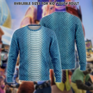 May include: A long-sleeve crewneck sweatshirt featuring a blue and white reptile scale pattern with a lighter vertical panel down the center. The text "AVAILABLE SIZES FOR KID/YOUTH/ADULT" is printed in white at the top of the image.