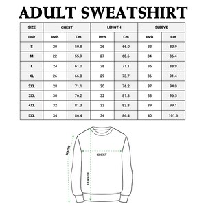 May include: Size chart for an adult sweatshirt with measurements in inches and centimeters for chest, length, and sleeve. The chart shows sizes from S to 5XL.