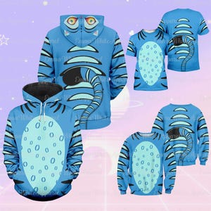 May include: A collection of blue apparel featuring a tiger design. The items include a hoodie, t-shirts, and a sweatshirt. The tiger design has black stripes and a light blue belly with oval spots. The hoodie has a black interior.
