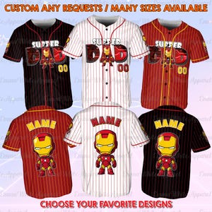 May include: Baseball jerseys with various designs. Some jerseys feature the text "SUPPER DAD" with a superhero graphic and the number "00". Other jerseys have the text "NAME" with a superhero graphic. The jerseys are red, black, and white with pinstripes.