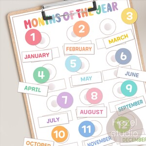 May include: A printable chart with the months of the year, numbered 1 through 12, with colorful circles and labels for each month. The chart is designed for educational purposes, helping children learn the order of the months.