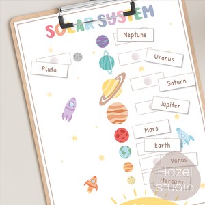 May include: A colorful printable solar system activity for kids. The planets are illustrated with a rainbow color scheme. The planets are labeled with their names: Pluto, Neptune, Uranus, Saturn, Jupiter, Mars, Earth, Venus, and Mercury. The sun is illustrated in the bottom right corner.