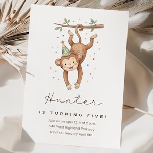 May include: A white invitation card featuring a watercolor illustration of a brown monkey wearing a party hat, hanging from a branch. The text "Hunter IS TURNING FIVE!" is displayed, along with event details. Colorful confetti dots surround the monkey.