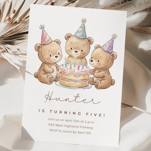 May include: A birthday invitation featuring three cartoon teddy bears wearing party hats, gathered around a cake with lit candles. The invitation reads "Hunter IS TURNING FIVE!" with event details below. The design is soft and whimsical.