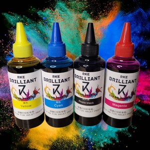 May include: Four bottles of ink for inkjet printers. The bottles are labeled with the brand name "RKE BRILLIANT" and the colors "Yellow", "Cyan", "Photo black", and "Magenta".