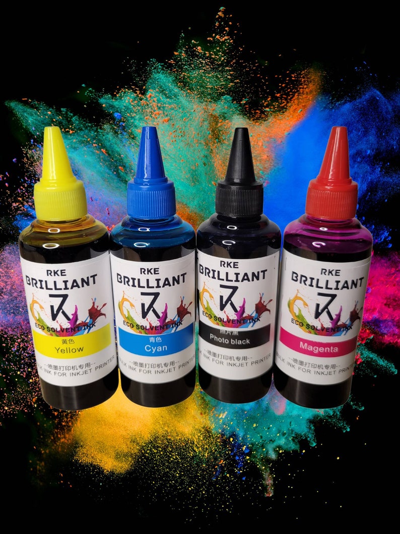 May include: Four bottles of ink for inkjet printers. The bottles are labeled with the brand name "RKE BRILLIANT" and the colors "Yellow", "Cyan", "Photo black", and "Magenta".