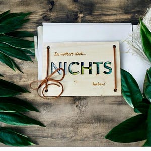 Geld Cadeaukaart Niets met leren band of klinknagels