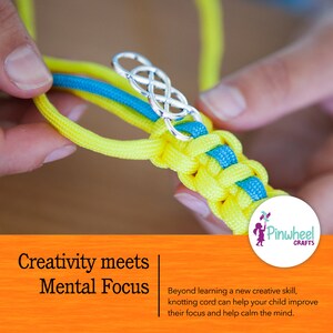May include: Close-up of a person's hands making a knot with yellow and blue cord. A silver charm in the shape of a knot is attached to the cord. The text "Creativity meets Mental Focus" is visible below the image.